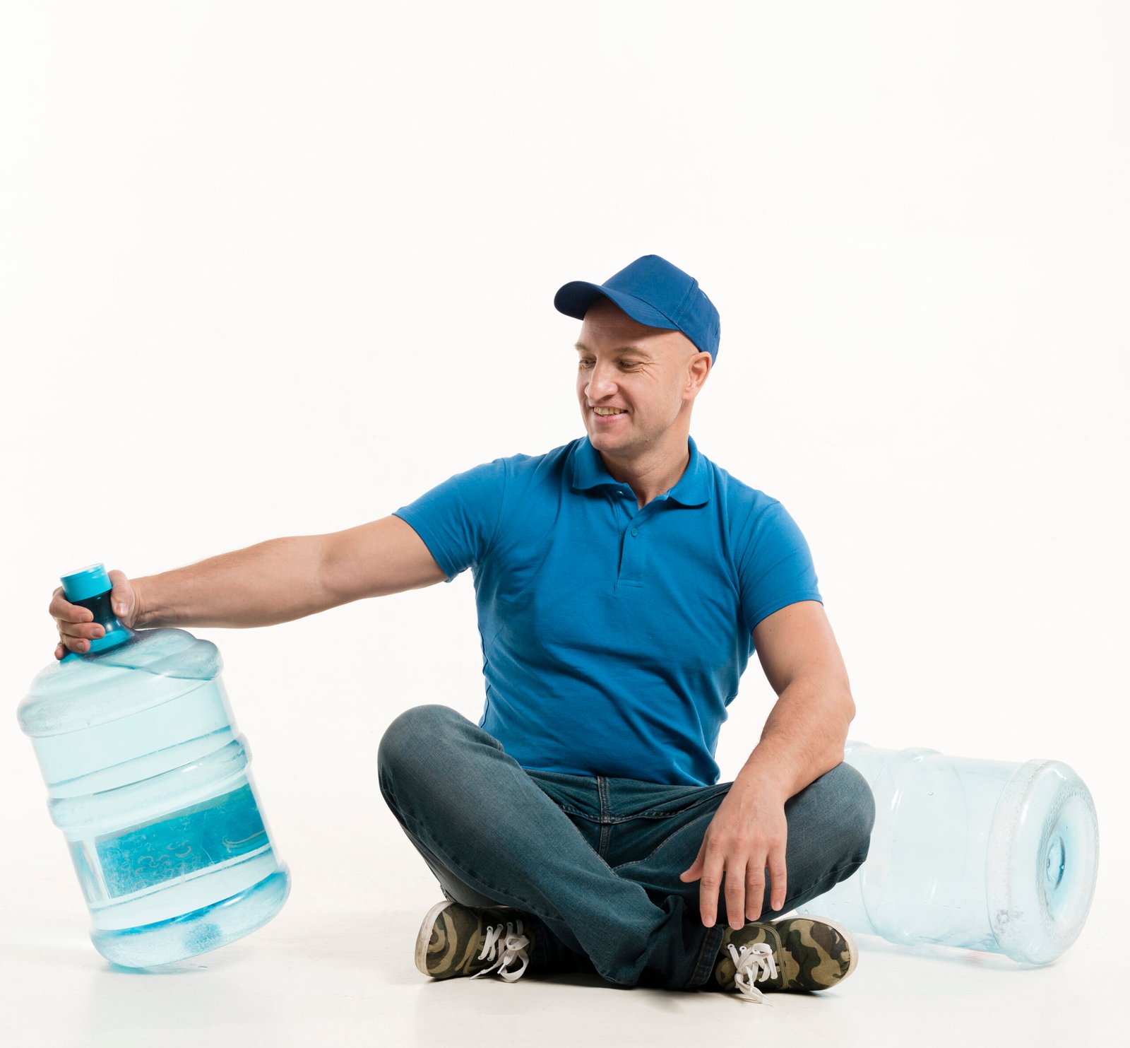 smiling-delivery-man-looking-water-bottle